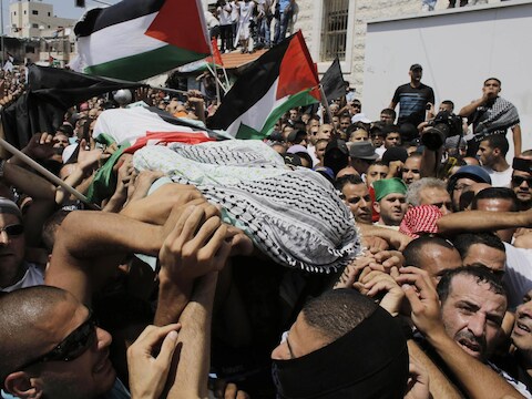 Het lichaam van de vermoorde Palestijnse tiener Mohammed Abu Khudair.