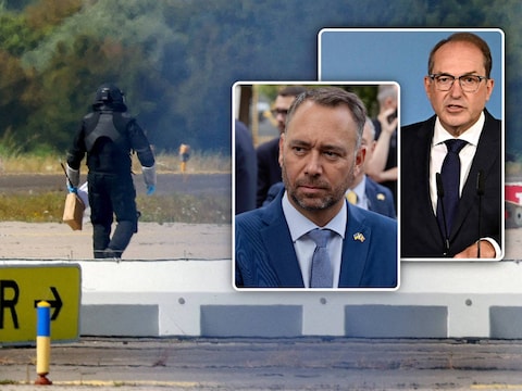 Agent in beschermende kledij aan het werk op de luchthaven van Leipzig. Inzet: Duitse minister van Binnenlandse Zaken Alexander Dobrindt en onze minister Prévot.