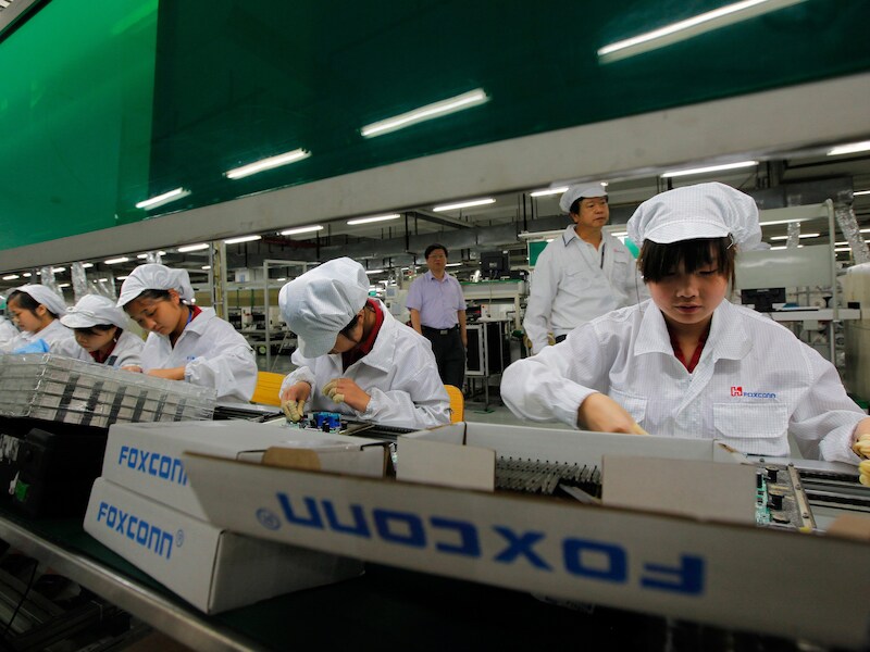 Werknemers van Foxconn in het Chinese Shenzhen.