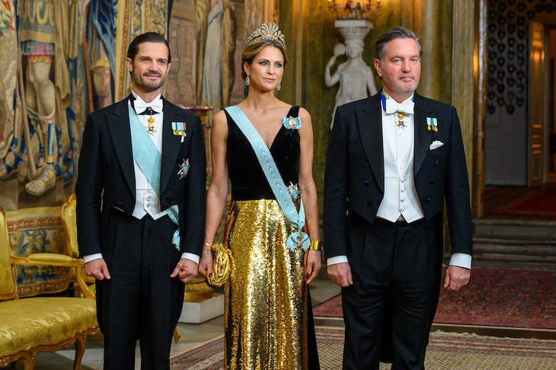Carl Philip (izquierda), junto a su hermana Madeleine y su marido Chris O'Neill.