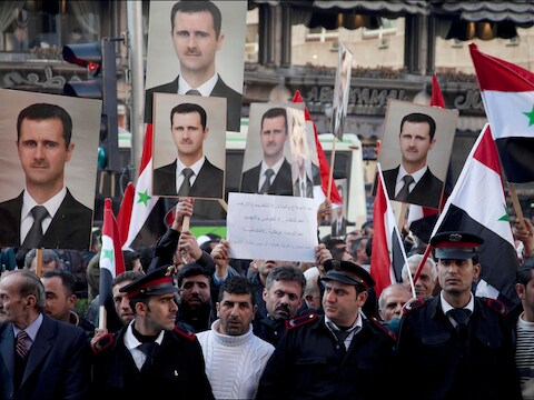 Aanhangers van Assad demonstreren in Damascus.