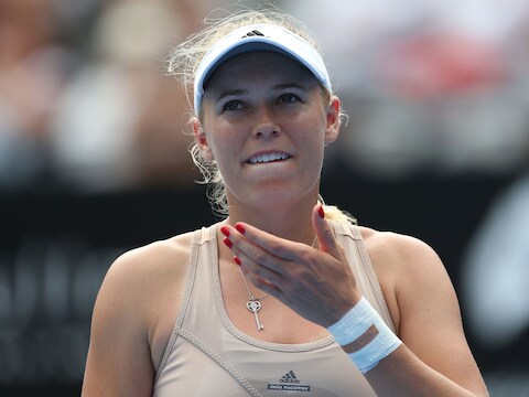 Het gezicht van Caroline Wozniacki spreekt boekdelen, de Deense moest in Sydney noodgedwongen de strijd staken.