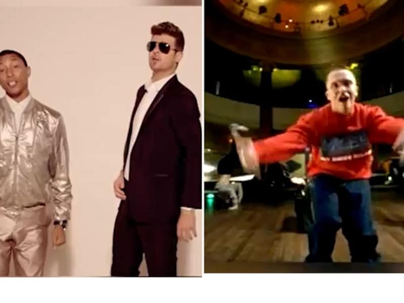 Pharrell Williams (links) en Robin Thicke, rechts de Nederlandse rapper Brainpower.