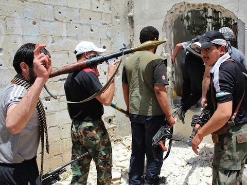 Syrische rebellen in de oude stad van Homs.