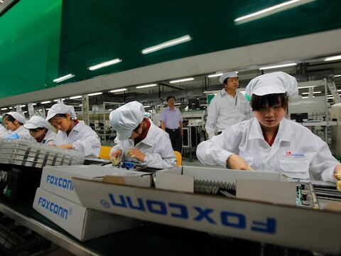 Werknemers van Foxconn in het Chinese Shenzhen.
