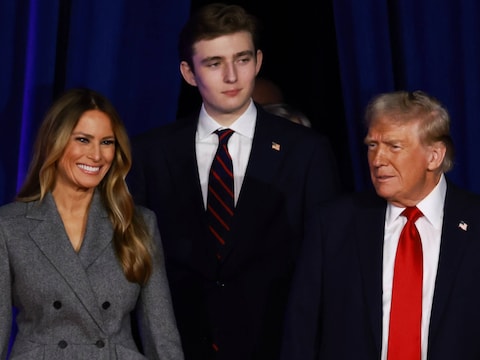 De Amerikaanse president Donald Trump met zijn vrouw Melania en hun zoon Barron. 