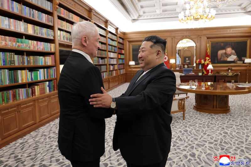 North Korean leader Kim Jong Un (right) greets Russian Defense Minister Andrei Beloussov at the headquarters of the Workers' Party of Korea Central Committee in Pyongyang.