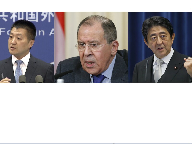 V.l.n.r: Woordvoerder van het Chinese ministerie van Buitenlandse Zaken Lu Kang, Russisch minister van Buitenlandse Zaken Sergej Lavrov en de Japanse premier Shinzo Abe