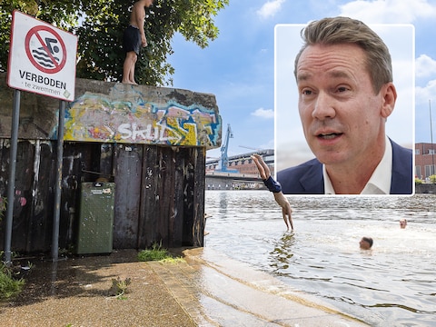 Tijdens de hittegolf van eind juni zochten jongeren verkoeling in het Gentse Houtdok, ondanks het bordje ‘verboden te zwemmen’.