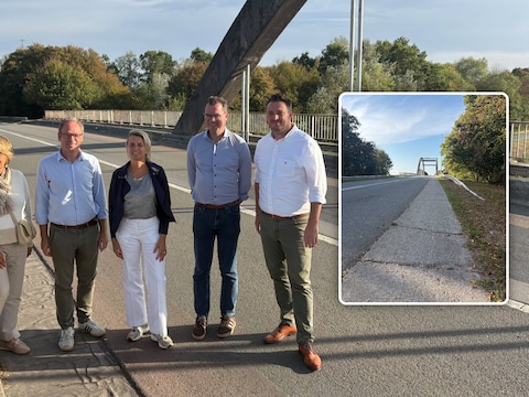 Het gemeentebestuur van Zulte en het stadsbestuur van Deinze op de brug over de Leie. Inzet: De betonstrook wordt vervangen door een afgescheiden fietspad.