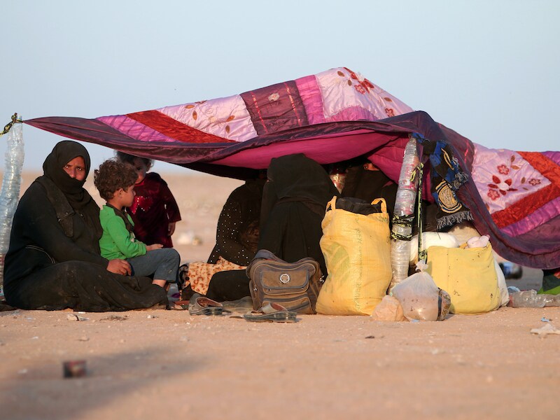 Irakese vluchtelingen uit Mosoel aan de Syrische grens.