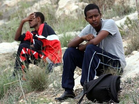Migranten in het tijdelijk opvangcentrum op Lampedusa.
