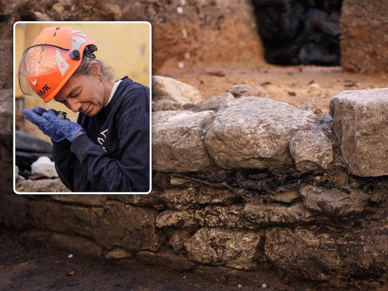 De muur uit de Gallo-Romeinse periode die werd ontdekt op het Île de la Cité in Parijs.Inzet: Archeologe Élodie Perugini aan het werk