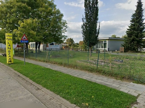 De man loste enkele schoten vlak bij de school in de Posthoornstraat. 