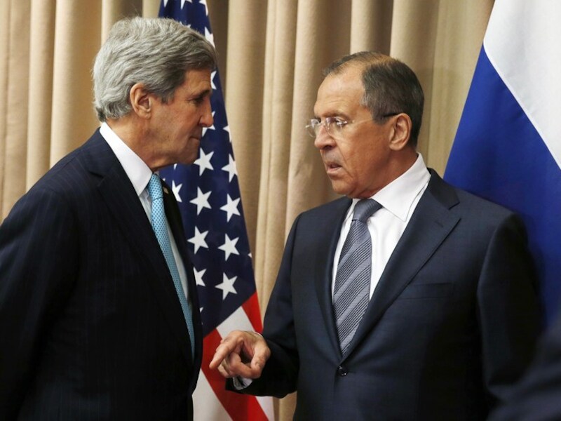 De Amerikaanse minister van Buitenlandse Zaken John Kerry met zijn Russische collega Sergej Lavrov in Genève deze week.