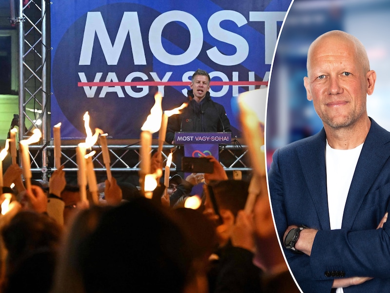 Aanhangers houden brandende toortsen vast tijdens de overwinningstoespraak van Péter Magyar. Na 16 jaar brengt hij een einde aan het beleid van Viktor Orbán  in Hongarije.