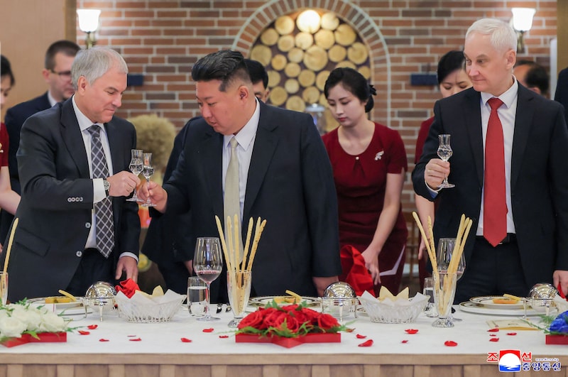 North Korean leader Kim Jong-un during a dinner with Russian State Duma Chairman Vyacheslav Volodin (left) and Defense Minister Andrei Beloussov (right) in Pyongyang.