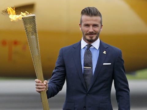 Beckham bij de aankomst van de olympische vlam in Groot-Brittannië.