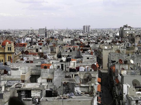 Verwoeste gebouwen in de Syrische stad Homs.