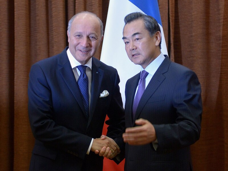 Buitenlandministers Wang Yi en Laurent Fabius.