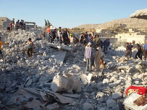 Een compleet vernield huizenblok na een Amerikaans bombardement in de Syrische stad Idlib.