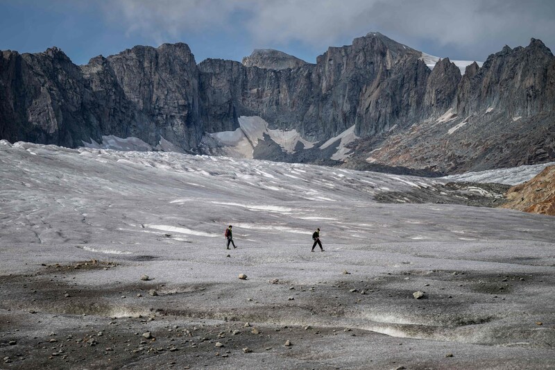 Hikers on Switzerland's Rhone Glacier in September last year.