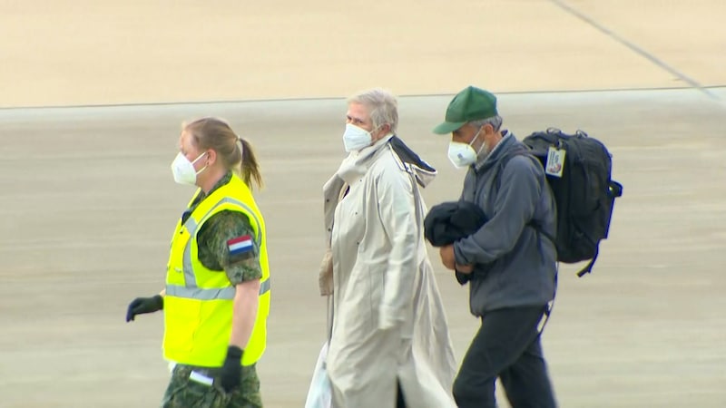 The two Belgian passengers were taken away after landing in Eindhoven. 