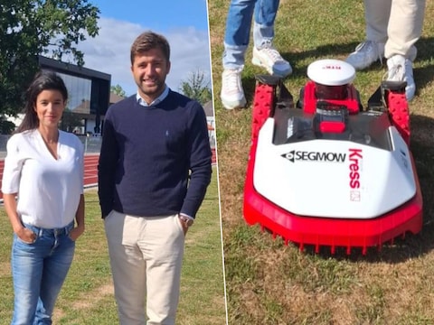 Burgemeester Nadia Sminate (N-VA) en schepen van Sport Wout Van Esbroeck (N-VA) naast een nieuwe maairobot
