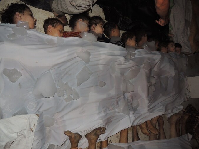 Lichamen van Syrische vrouwen en kinderen in Damascus.