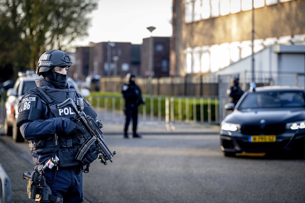 Nederlandse drugsbaron Ridouan Taghi veroordeeld tot levenslang ...