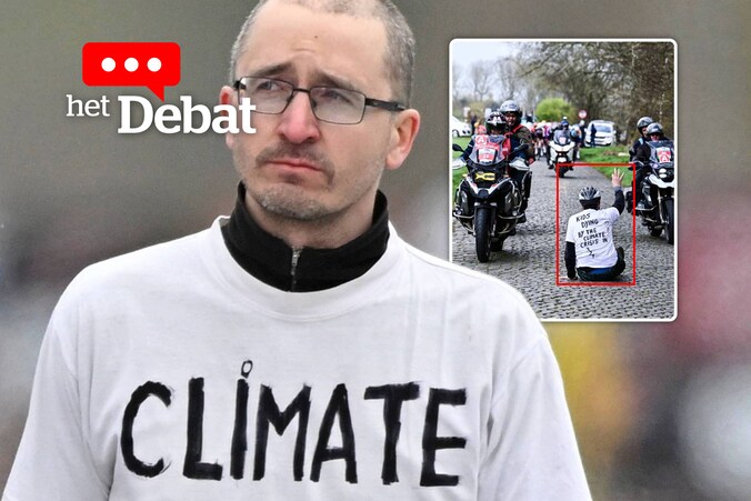 Wouter Mouton ging gisteren op de kasseien zitten vlak voor het peloton eraan kwam. Hij wil hiermee aandacht vragen voor de klimaatcrisis