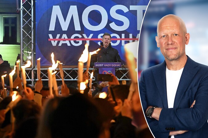 Aanhangers houden brandende toortsen vast tijdens de overwinningstoespraak van Péter Magyar. Na 16 jaar brengt hij een einde aan het beleid van Viktor Orbán  in Hongarije.