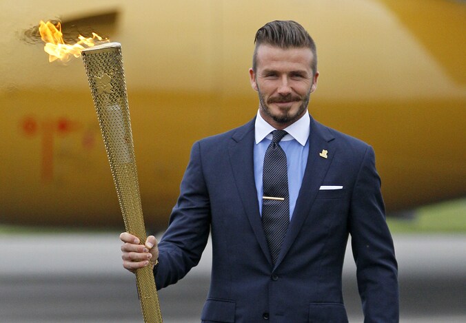 Beckham bij de aankomst van de olympische vlam in Groot-Brittannië.