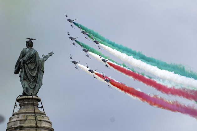 The Italian Air Force demonstration team Frecce Tricolori flies over the Fori Imperiali.