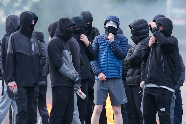 Masked youth protest in Belfast.