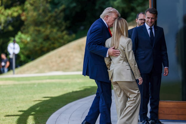 Trump with Meloni and French President Emmanuel Macron at the G7 summit.