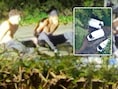 Twee van de vijf verdachten die met de handen op de rug geboeid werden. Inzet: de drie bestelwagens die de baan blokkeerden.