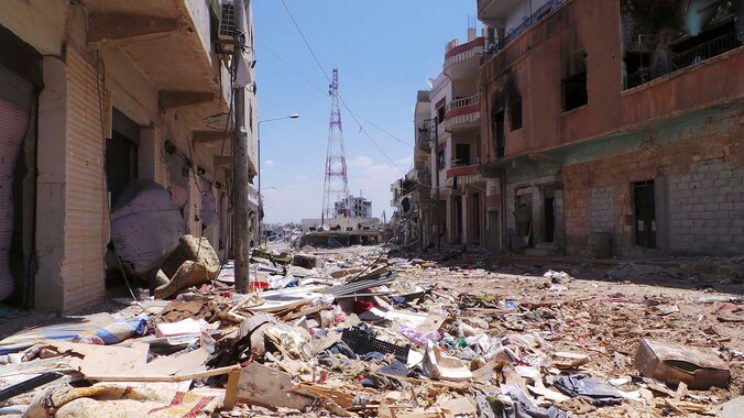 Verwoeste gebouwen in Deraa, waar de Syrische opstand in maart 2011 begon.