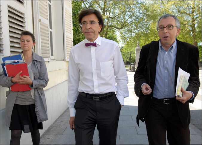 Premier Elio Di Rupo (midden).