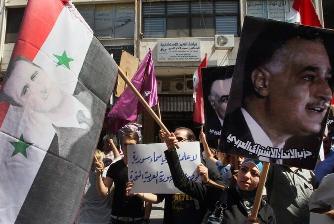 Protest in Damascus tegen de inmenging van de Amerikanen en hun bondgenoten, dinsdag.