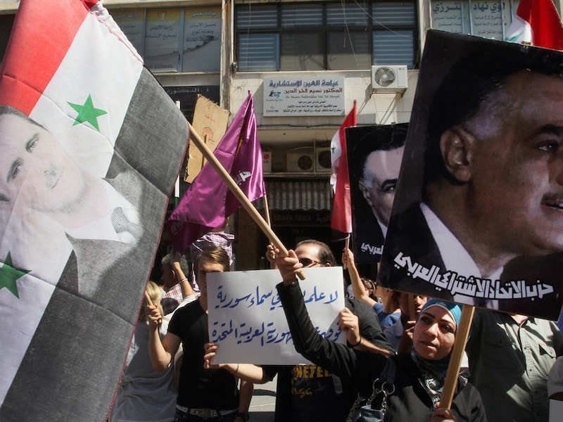 Protest in Damascus tegen de inmenging van de Amerikanen en hun bondgenoten, dinsdag.