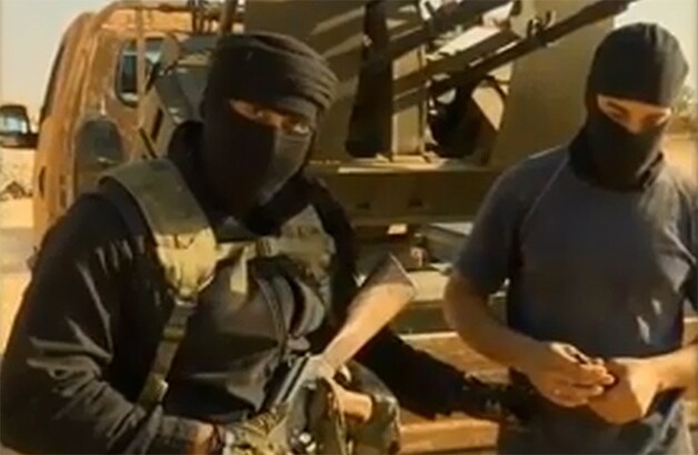 Imran Khawaja (links) die zich Abu Daigham al Baritani of Abu Daigham al-Britani liet noemen