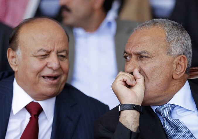 President Ali Abdullah Saleh (rechts) en zijn vicepresident Abdraboeh Mansoer Hadi (links).