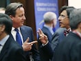 David Cameron in gesprek met Elio Di Rupo.