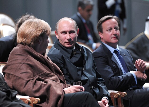 De Duitse bondskanselier Angela Merkel, de Russische president Vladimir Poetin en de Britse premier David Cameron.