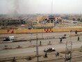 De brandende stad Fallujah.