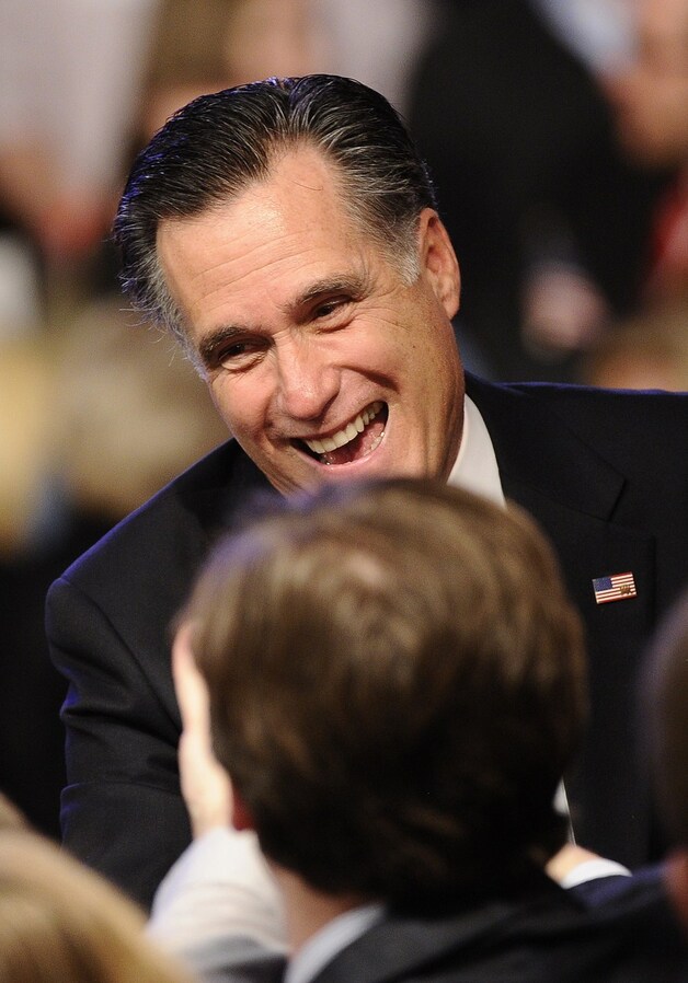 Een glunderende Mitt Romney