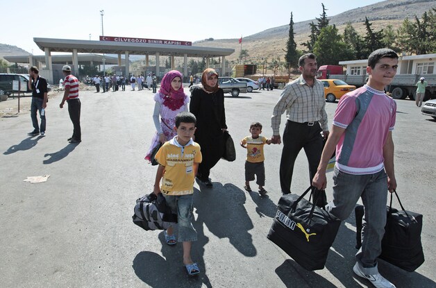 Syrische vluchtelingen aan de Turkse grens.