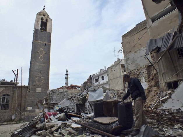 Een door de oorlog verwoeste wijk in Homs.