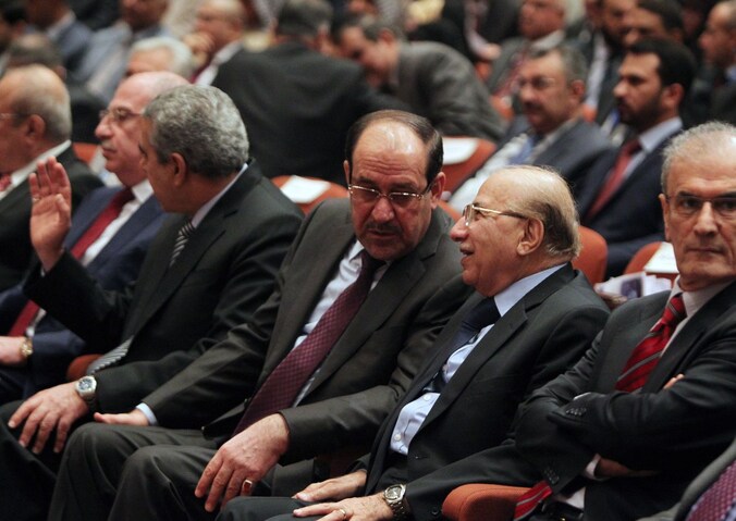 De Iraakse premier Al-Maliki (midden).